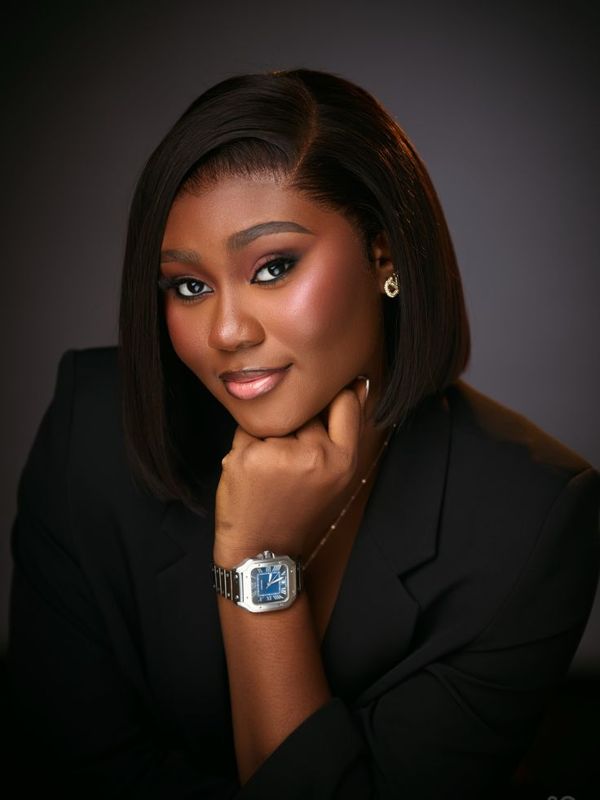 Cardx customer in a black blazer wearing a wristwatch